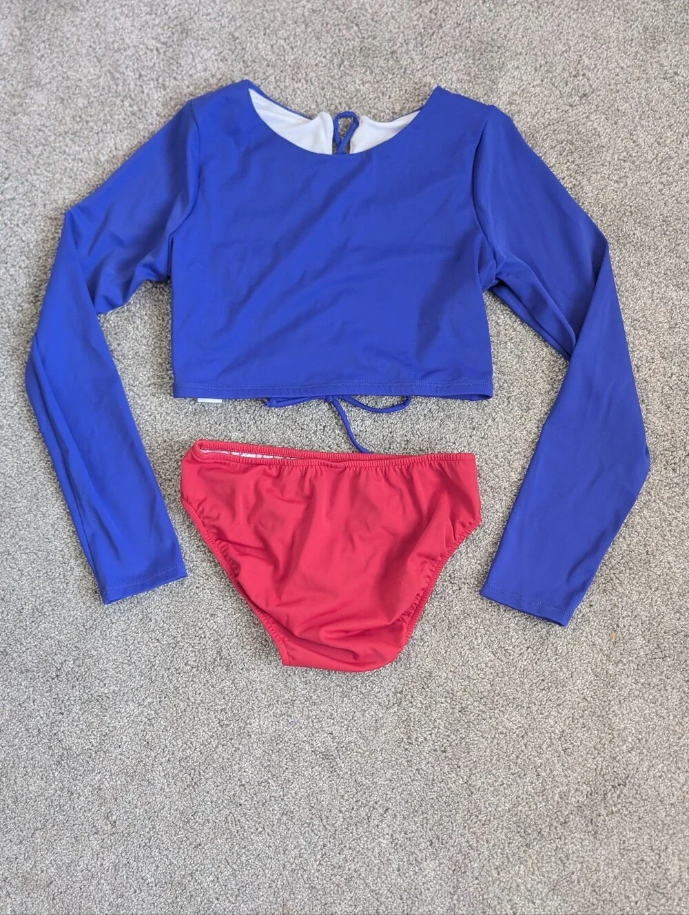 Blue Lace-Up Long Sleeve Rashguard And Red Bikini